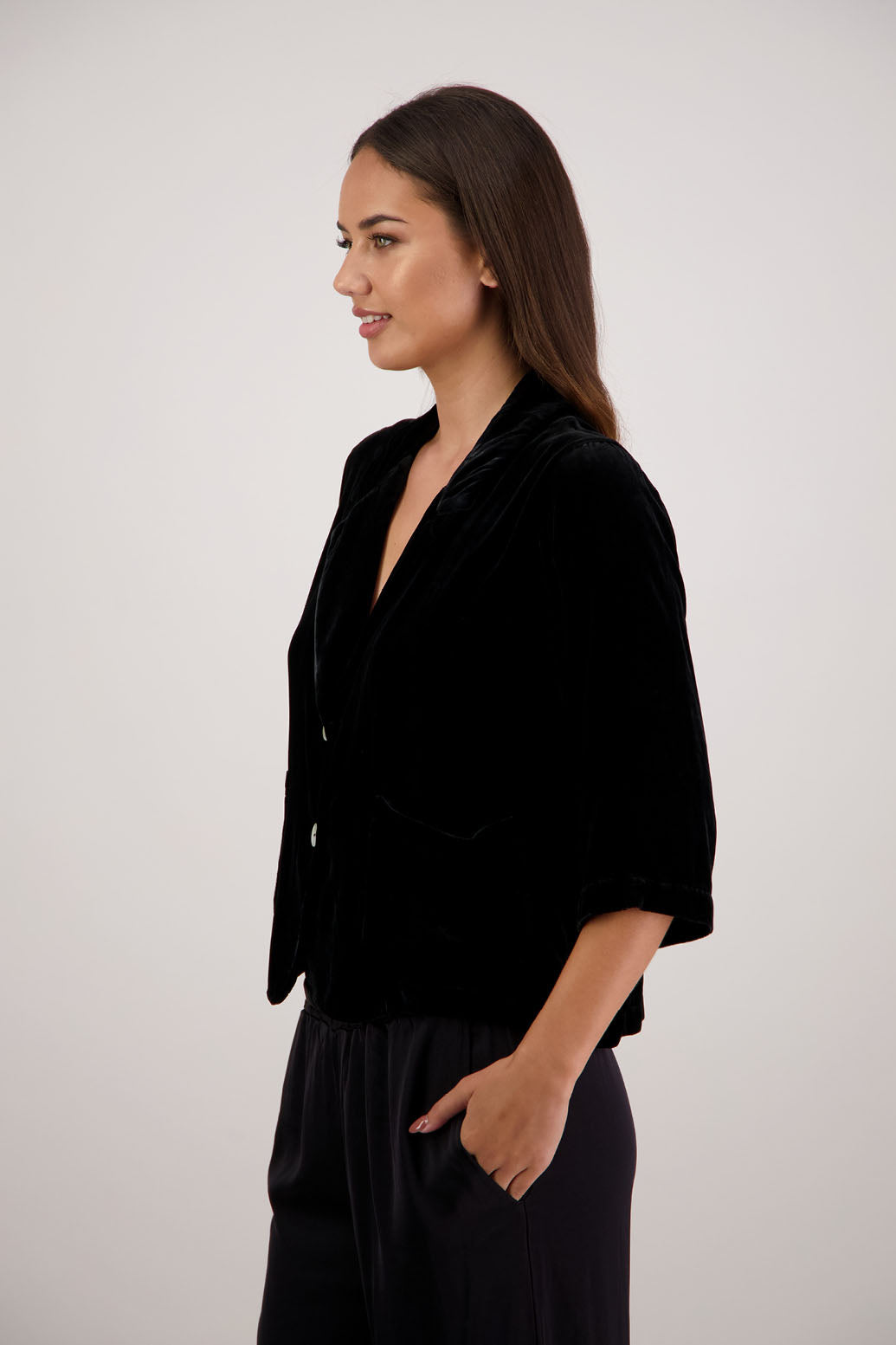 Rita Jacket in Black Velvet by Briarwood NZ. A
18% Silk, 82% Rayon Velvet Jacket with 3/4 length sleeves, soft collar, double button closure, soft pockets, back split