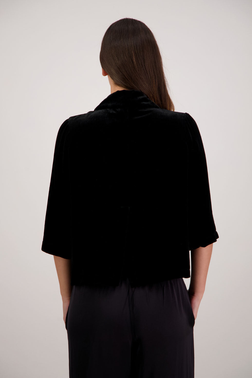 Rita Jacket in Black Velvet by Briarwood NZ. A
18% Silk, 82% Rayon Velvet Jacket with 3/4 length sleeves, soft collar, double button closure, soft pockets, back split