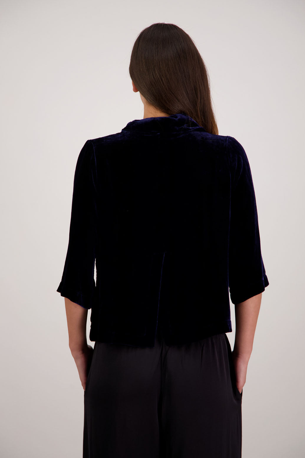 Rita Jacket in Ink Velvet by Briarwood NZ. A
18% Silk, 82% Rayon Velvet Jacket with 3/4 length sleeves, soft collar, double button closure, soft pockets, back split
