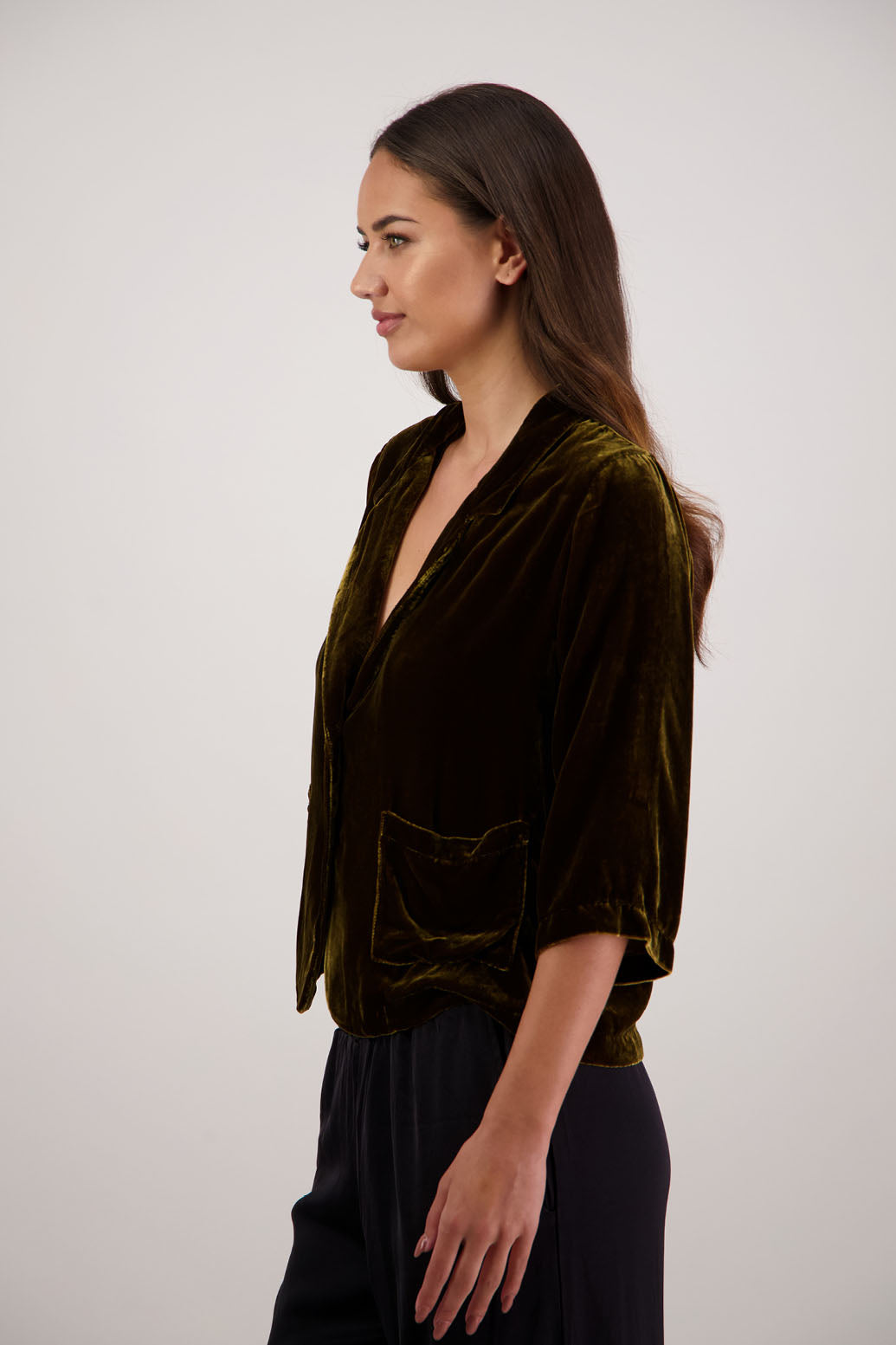 Rita Jacket in Tan Velvet by Briarwood NZ. A
18% Silk, 82% Rayon Velvet Jacket with 3/4 length sleeves, soft collar, double button closure, soft pockets, back split
