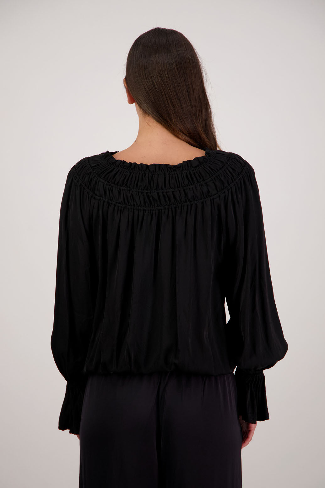 Rosemarie Top in Black by Briarwood NZ. 100% viscose top with 3 panel gathered neck, full length sleeves with ruffle, elasticated waistband