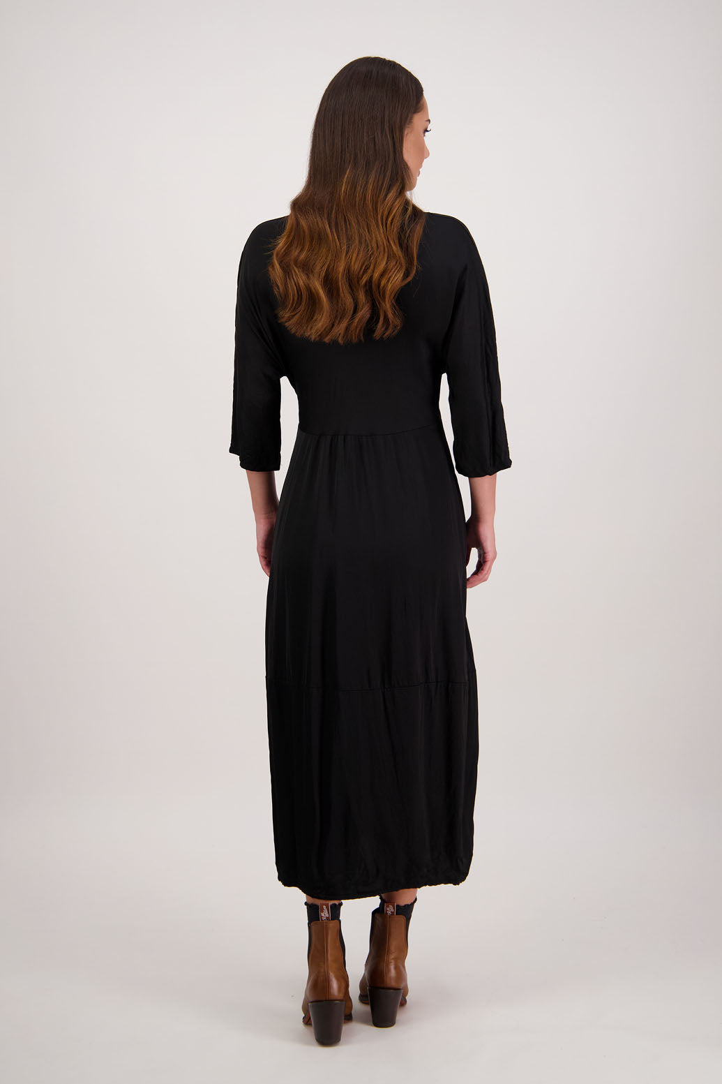Rowena Dress in Black by Briarwood NZ. 100% viscose dress, roll neck, bias cut top, puff hem start, 3/4 sleeves, pockets, lined