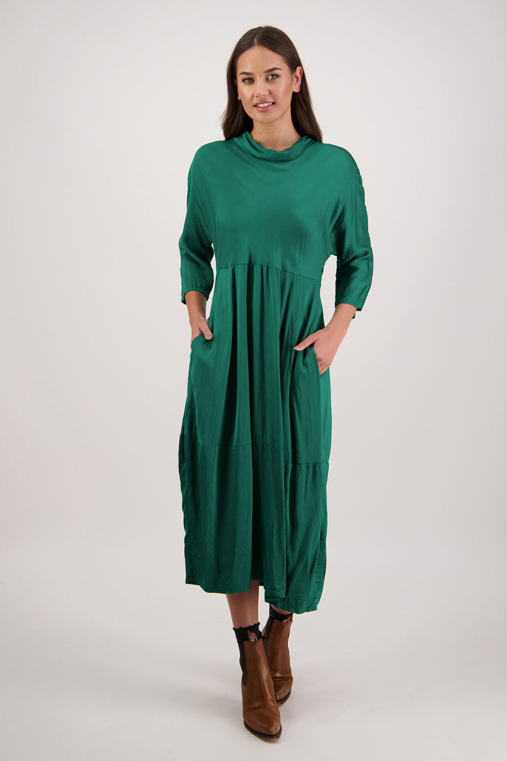 Rowena Dress in Emerald by Briarwood NZ. 100% viscose dress, roll neck, bias cut top, puff hem start, 3/4 sleeves, pockets, lined