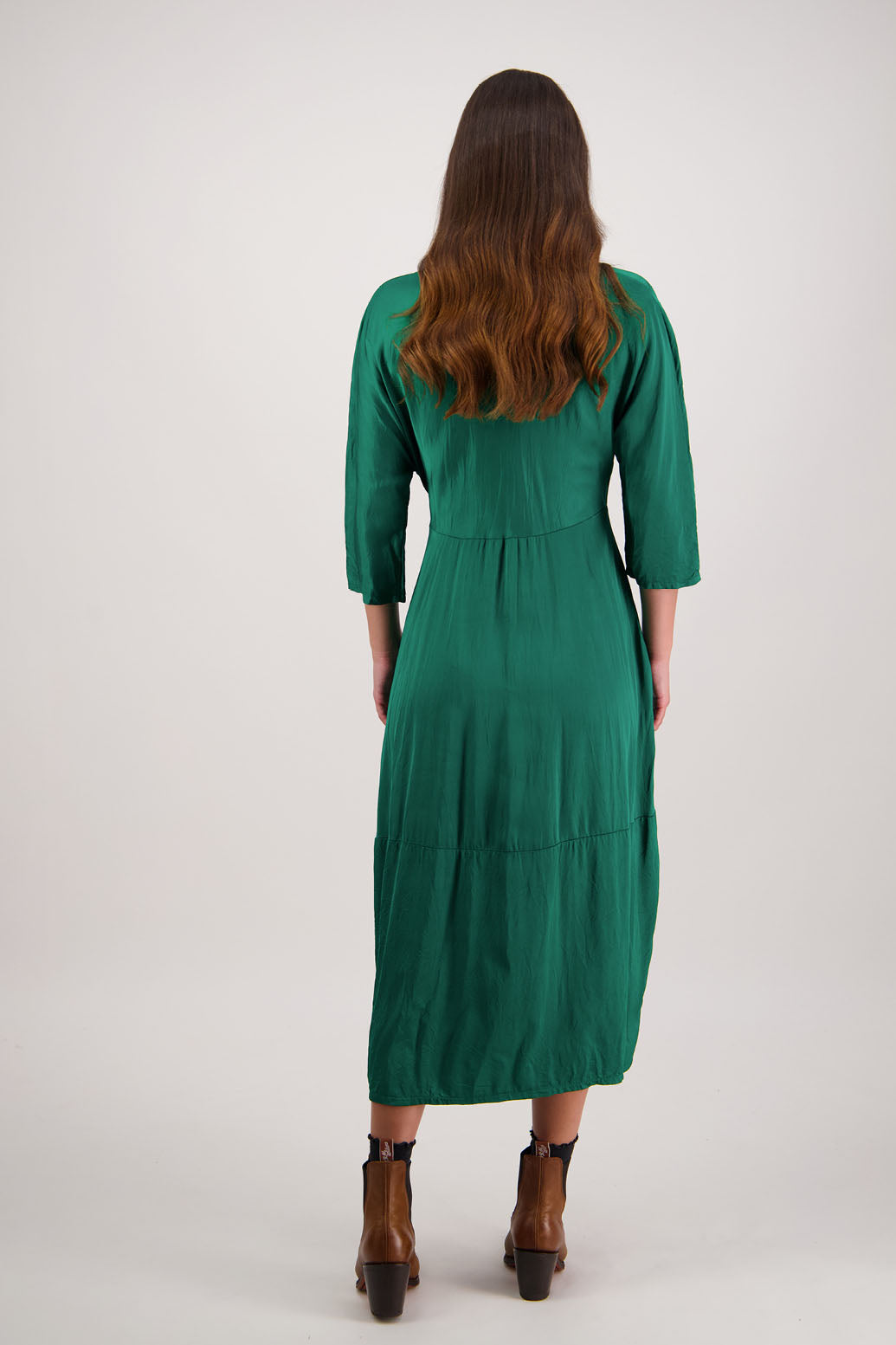 Rowena Dress in Emerald by Briarwood NZ. 100% viscose dress, roll neck, bias cut top, puff hem start, 3/4 sleeves, pockets, lined