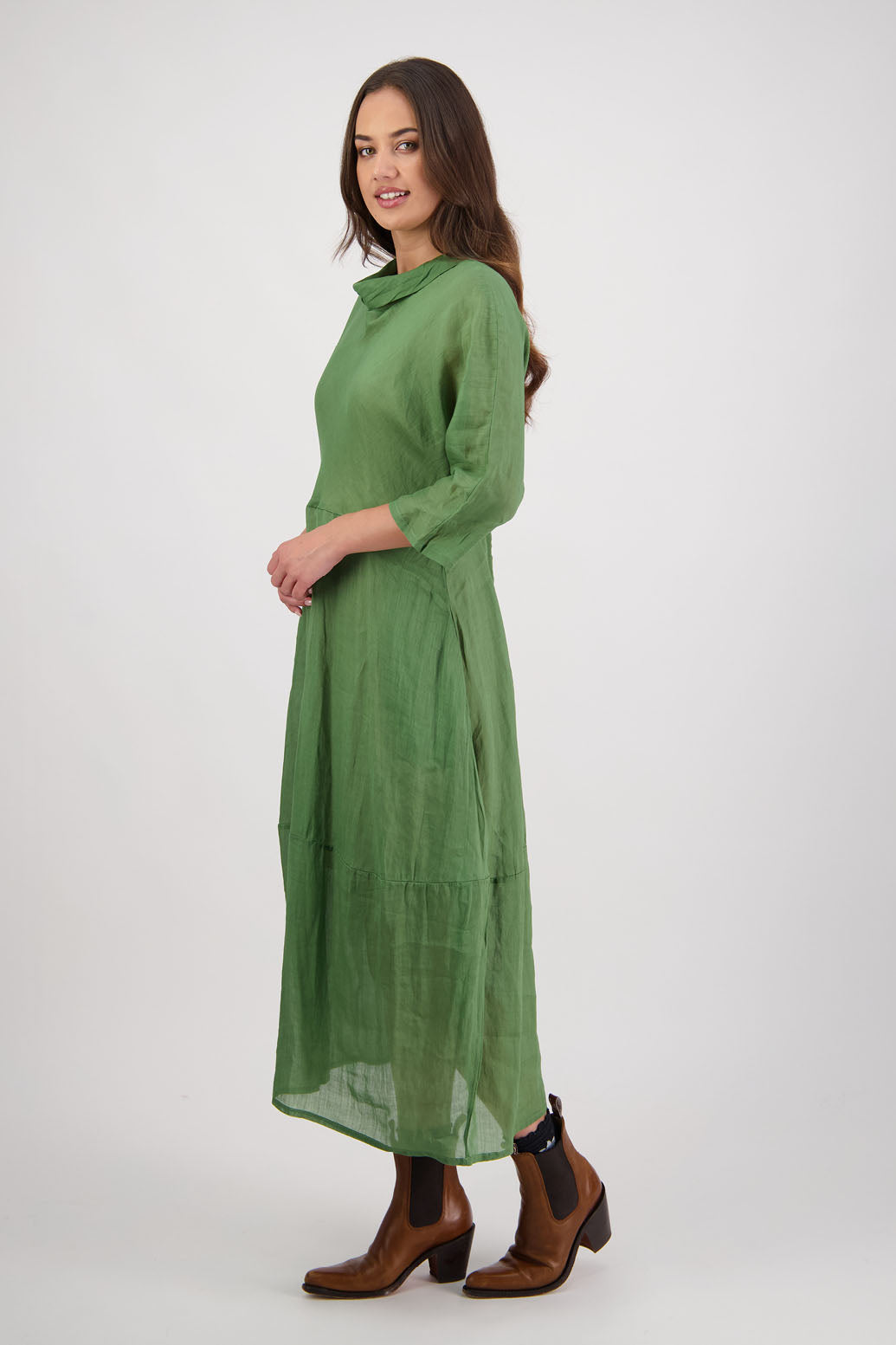 Rowena Dress in Grass by Briarwood NZ. 100% Ramie dress, roll neck, bias cut top, puff hem start, 3/4 sleeves, pockets, lined