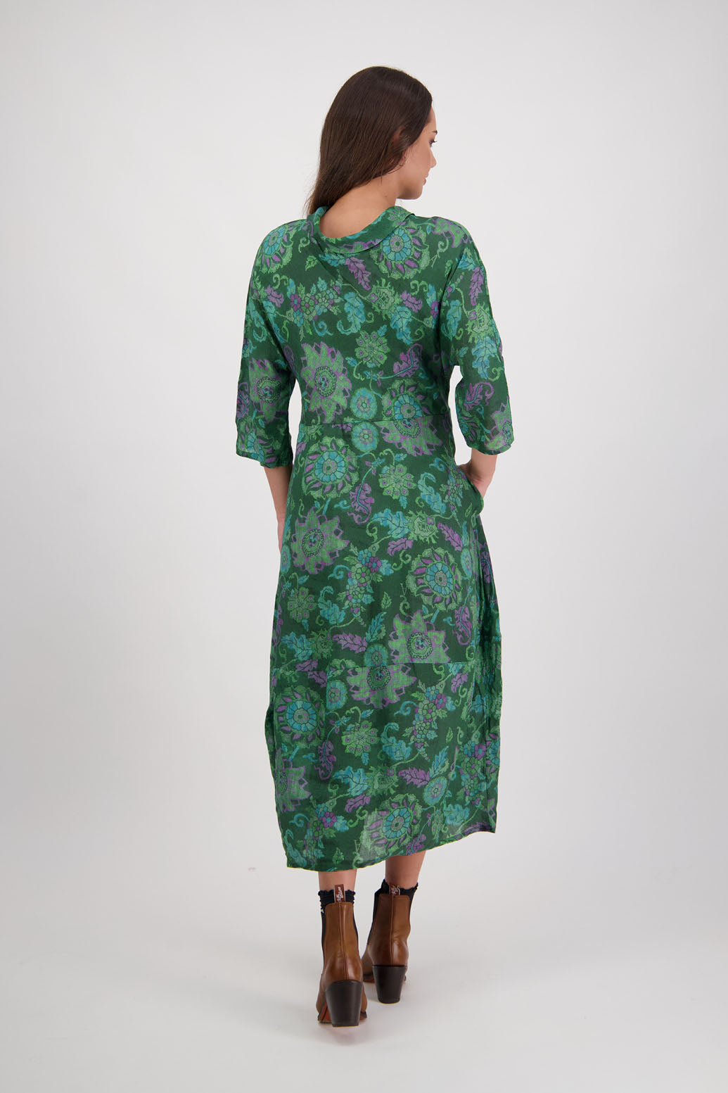 Rowena Dress in Green Floral by Briarwood NZ. 100% Ramie dress, roll neck, bias cut top, puff hem start, 3/4 sleeves, pockets, lined