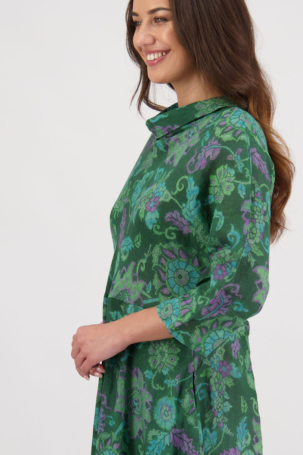 Rowena Dress in Green Floral by Briarwood NZ. 100% Ramie dress, roll neck, bias cut top, puff hem start, 3/4 sleeves, pockets, lined
