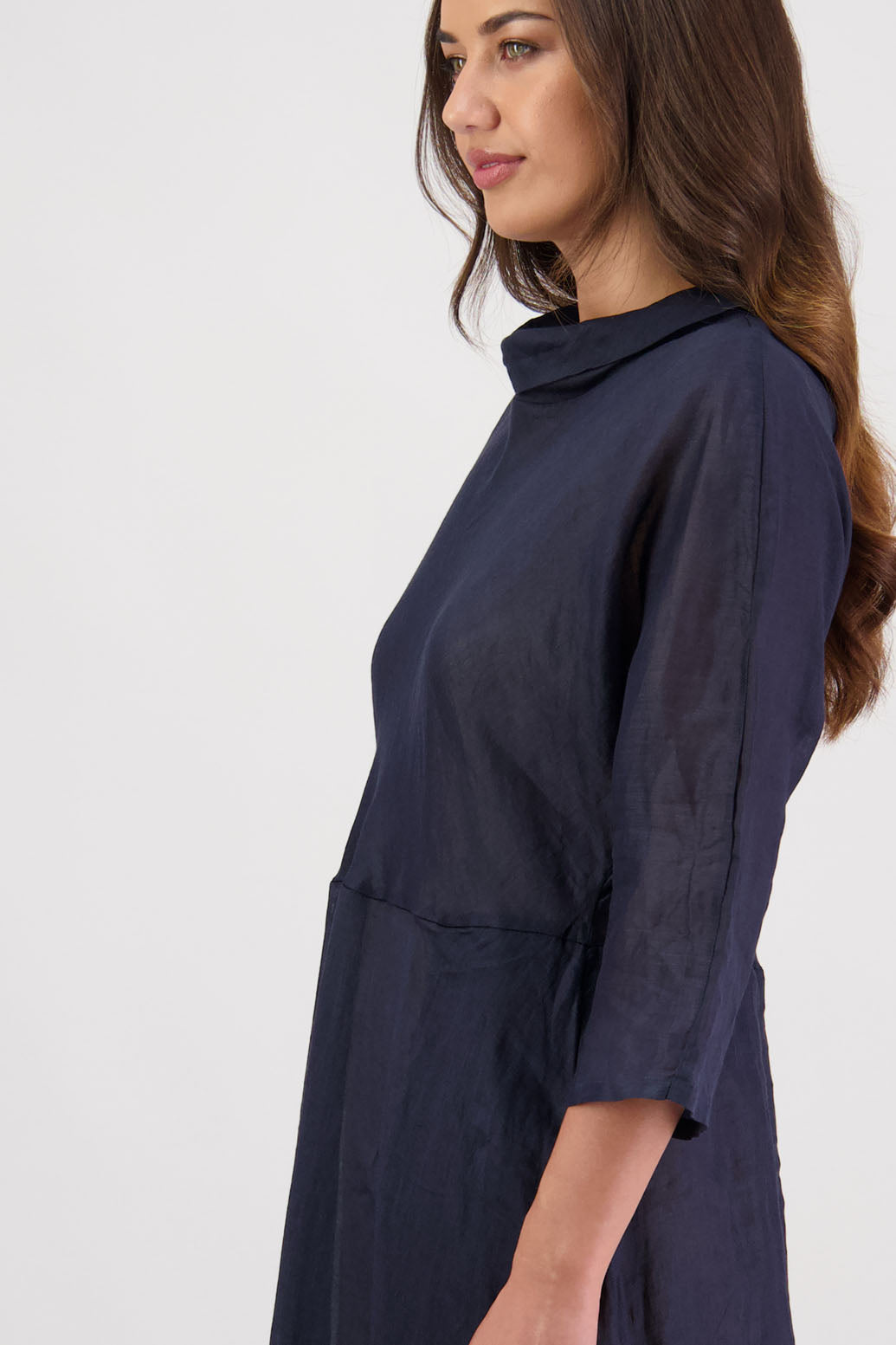 Rowena Dress in Ink by Briarwood NZ. 100% Ramie dress, roll neck, bias cut top, puff hem start, 3/4 sleeves, pockets, lined