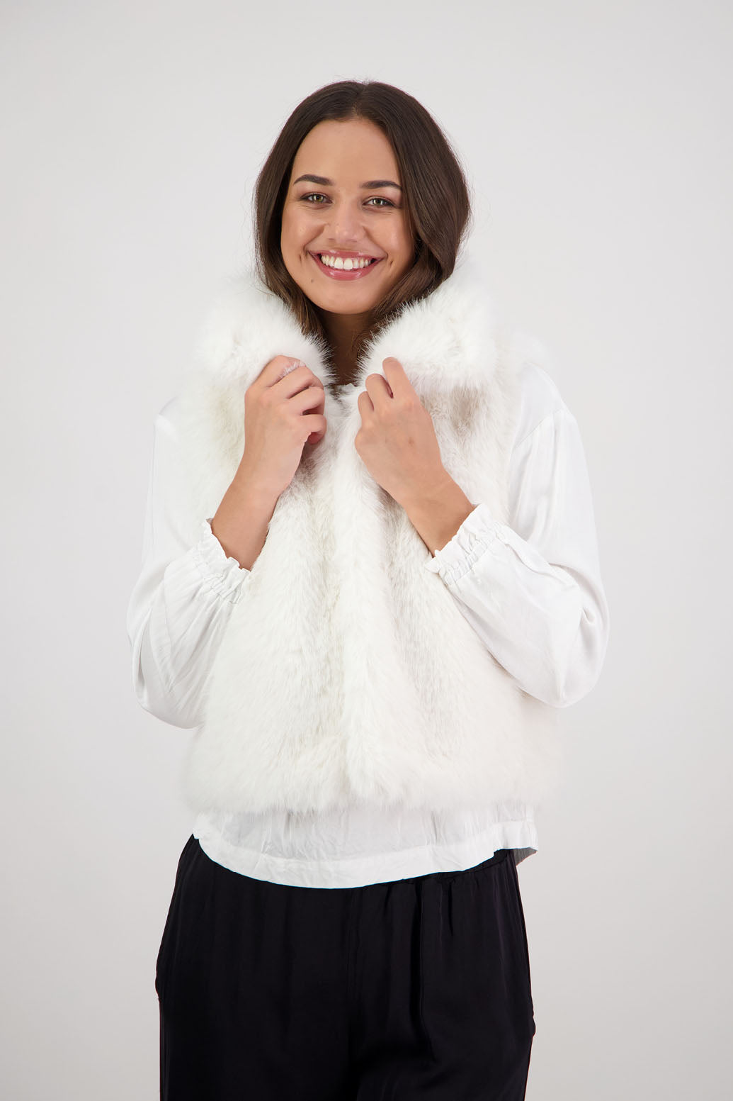 Royal Fluffy Vest in White by Briarwood NZ. Fluffy faux fur polyester vest, collar, hook and eye closure, pockets