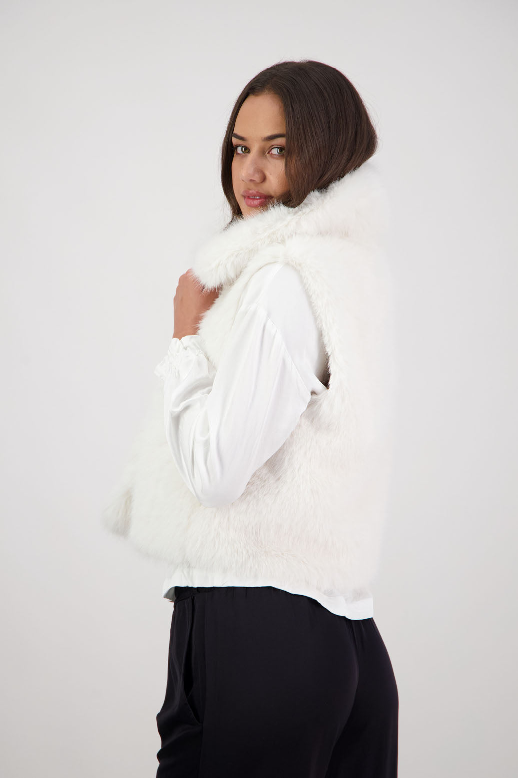 Royal Fluffy Vest in White by Briarwood NZ. Fluffy faux fur polyester vest, collar, hook and eye closure, pockets