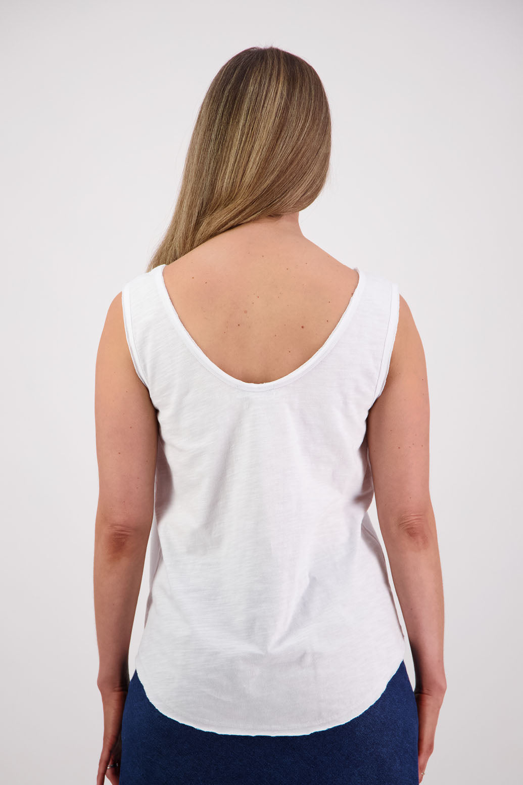 Womens cotton singlet with shaped hem and raw edges. Briarwood NZ. Sala, White