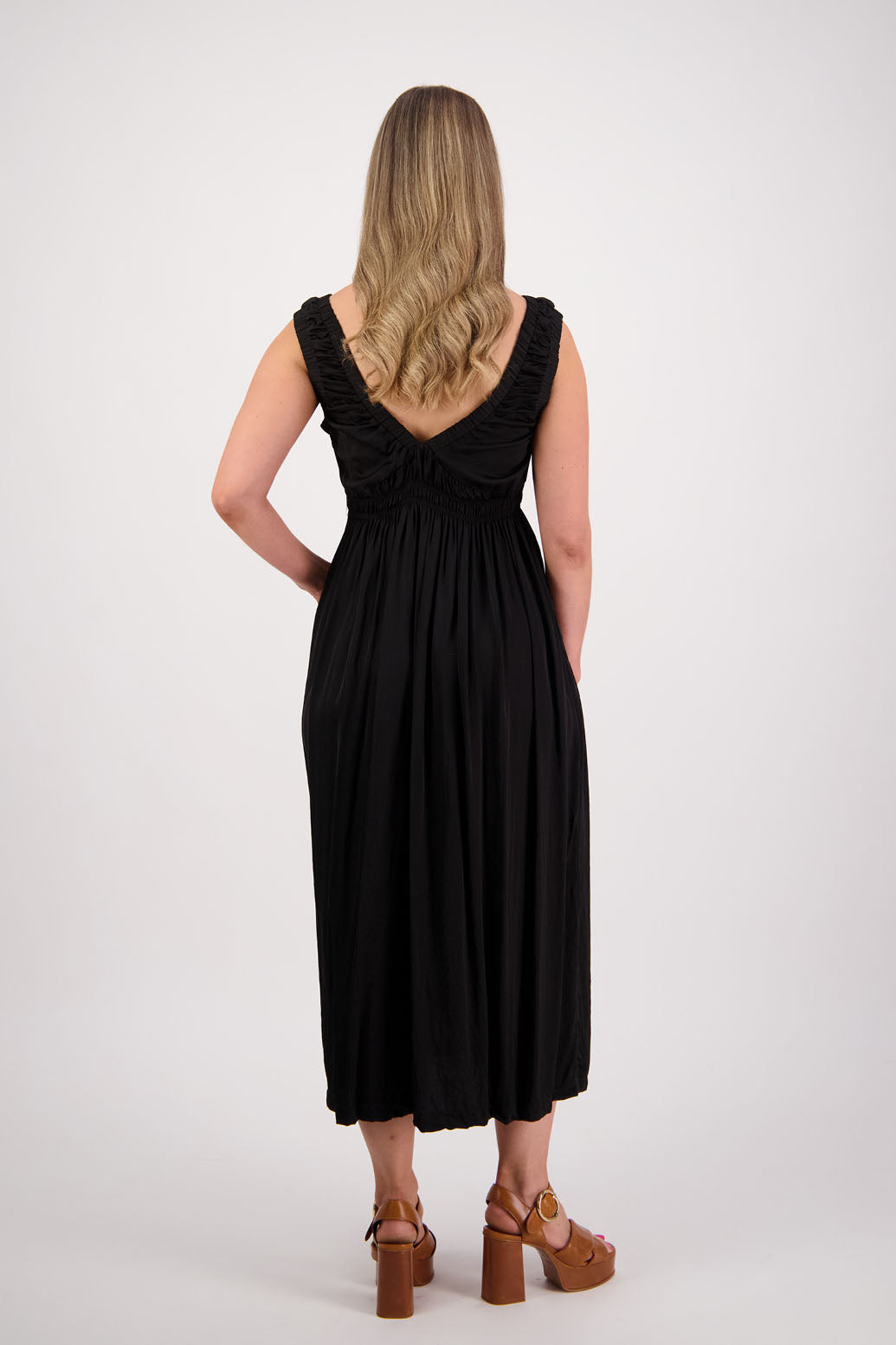 Womens long viscose black dress. Sleeveless with v neck and gathered shoulders and the bust. Elastic waist and pockets. Briarwood NZ. Sapphire.