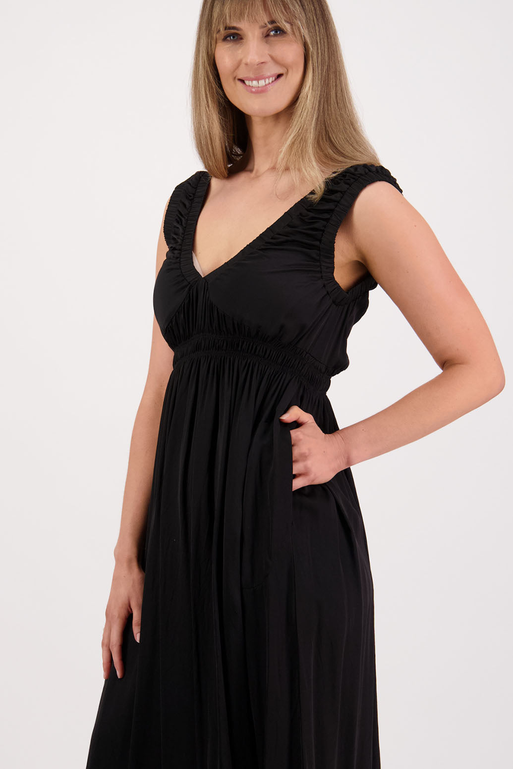Womens long viscose black dress. Sleeveless with v neck and gathered shoulders and the bust. Elastic waist and pockets. Briarwood NZ. Sapphire.