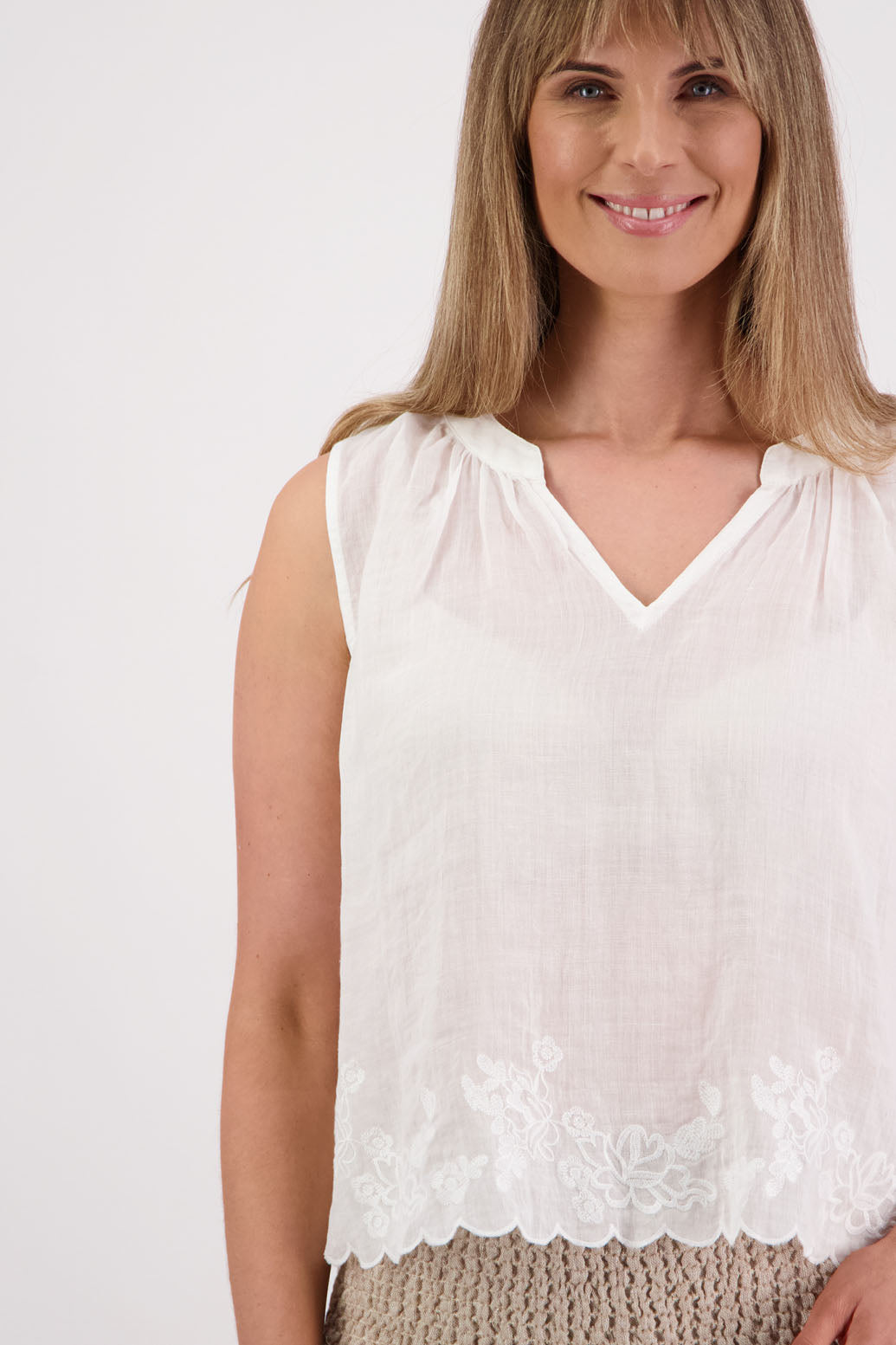 Briarwood NZ Sara Top. White, sleeveless, V neck, embroidered bottom