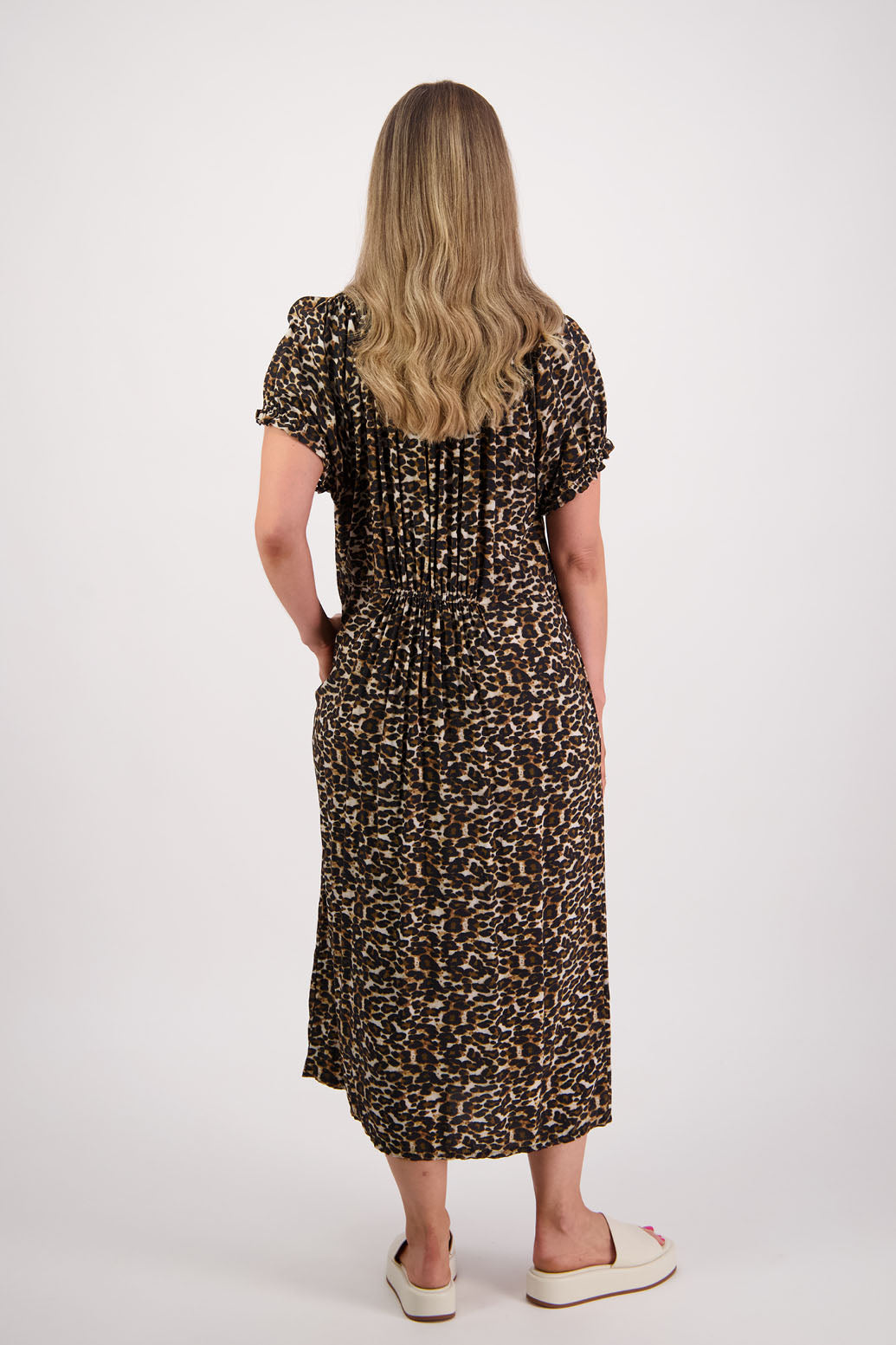 Womens long leopard print dress with slightly gathered centre panel, Ruffle around the neck and sleeves and pockets. Viscose. Briarwood NZ. Sasha