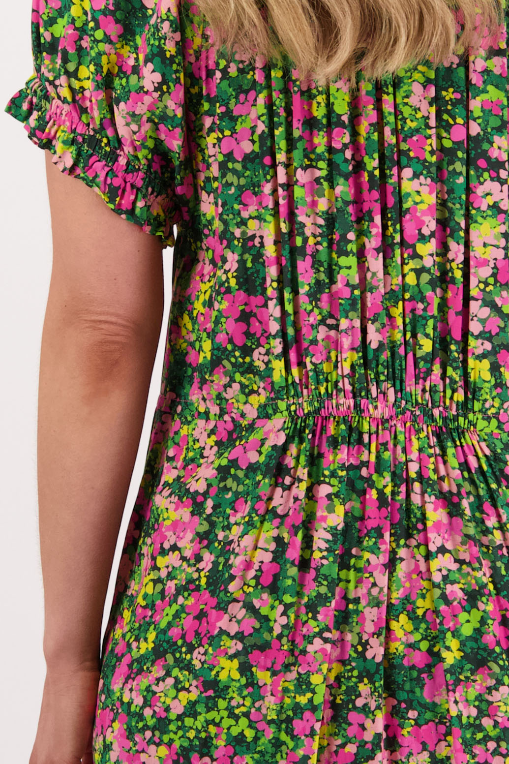Womens long pansy print dress with slightly gathered centre panel, Ruffle around the neck and sleeves and pockets. Viscose. Briarwood NZ. Sasha