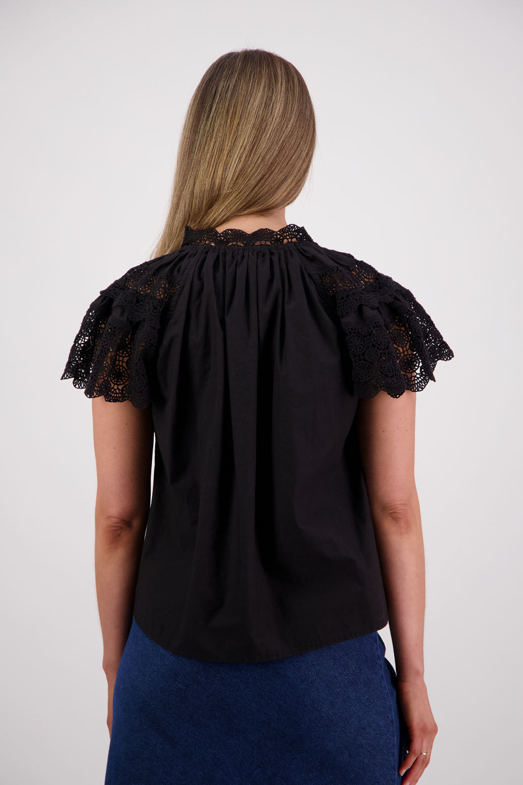 Womens short sleeve black top with lace trim sleeves and lace trim down the front. Briarwood NZ. Cotton Poplin / Lace. Sebbie