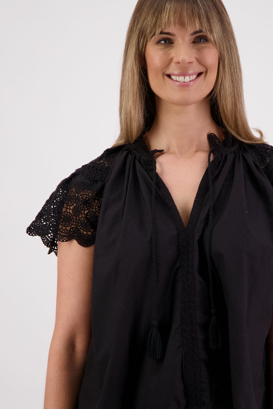 Womens short sleeve black top with lace trim sleeves and lace trim down the front. Briarwood NZ. Cotton Poplin / Lace. Sebbie