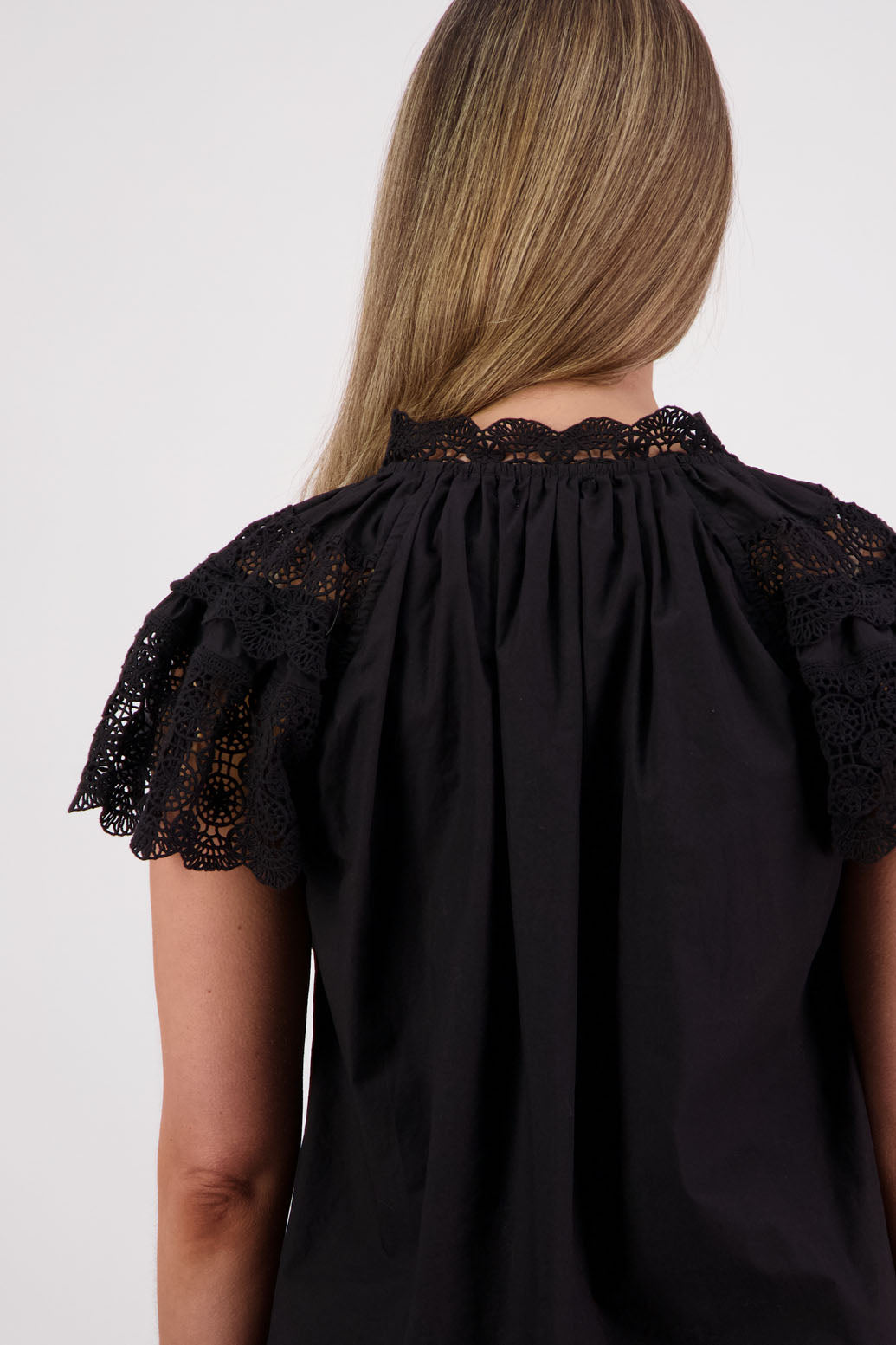 Womens short sleeve black top with lace trim sleeves and lace trim down the front. Briarwood NZ. Cotton Poplin / Lace. Sebbie