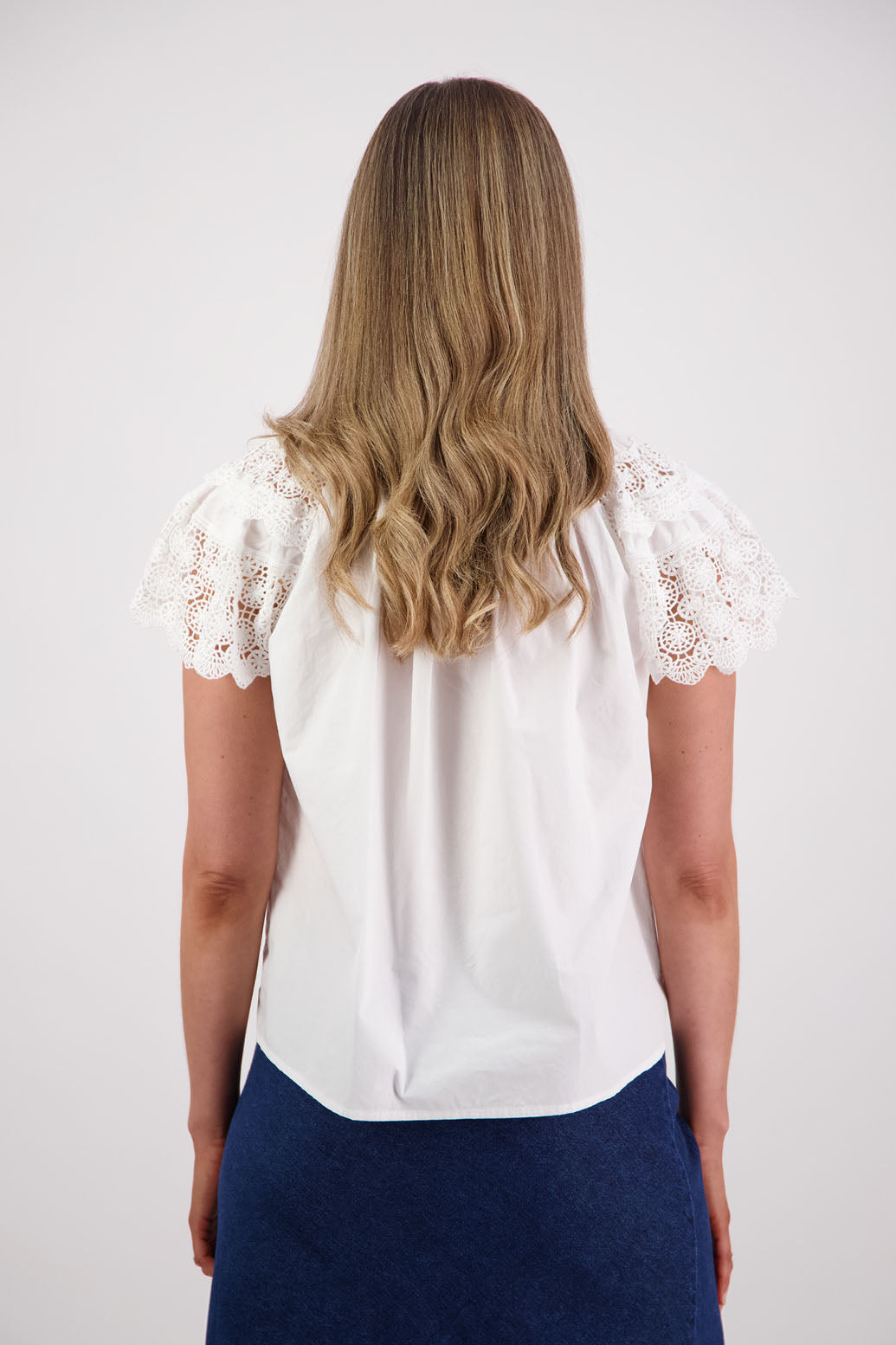 Womens short sleeve white top with lace trim sleeves and lace trim down the front. Briarwood NZ. Cotton Poplin / Lace. Sebbie