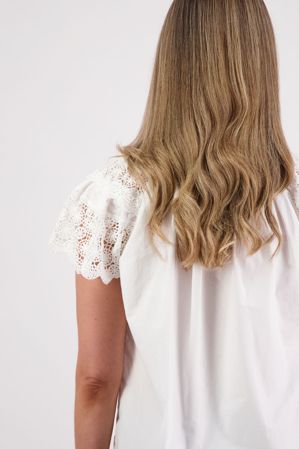 Womens short sleeve white top with lace trim sleeves and lace trim down the front. Briarwood NZ. Cotton Poplin / Lace. Sebbie