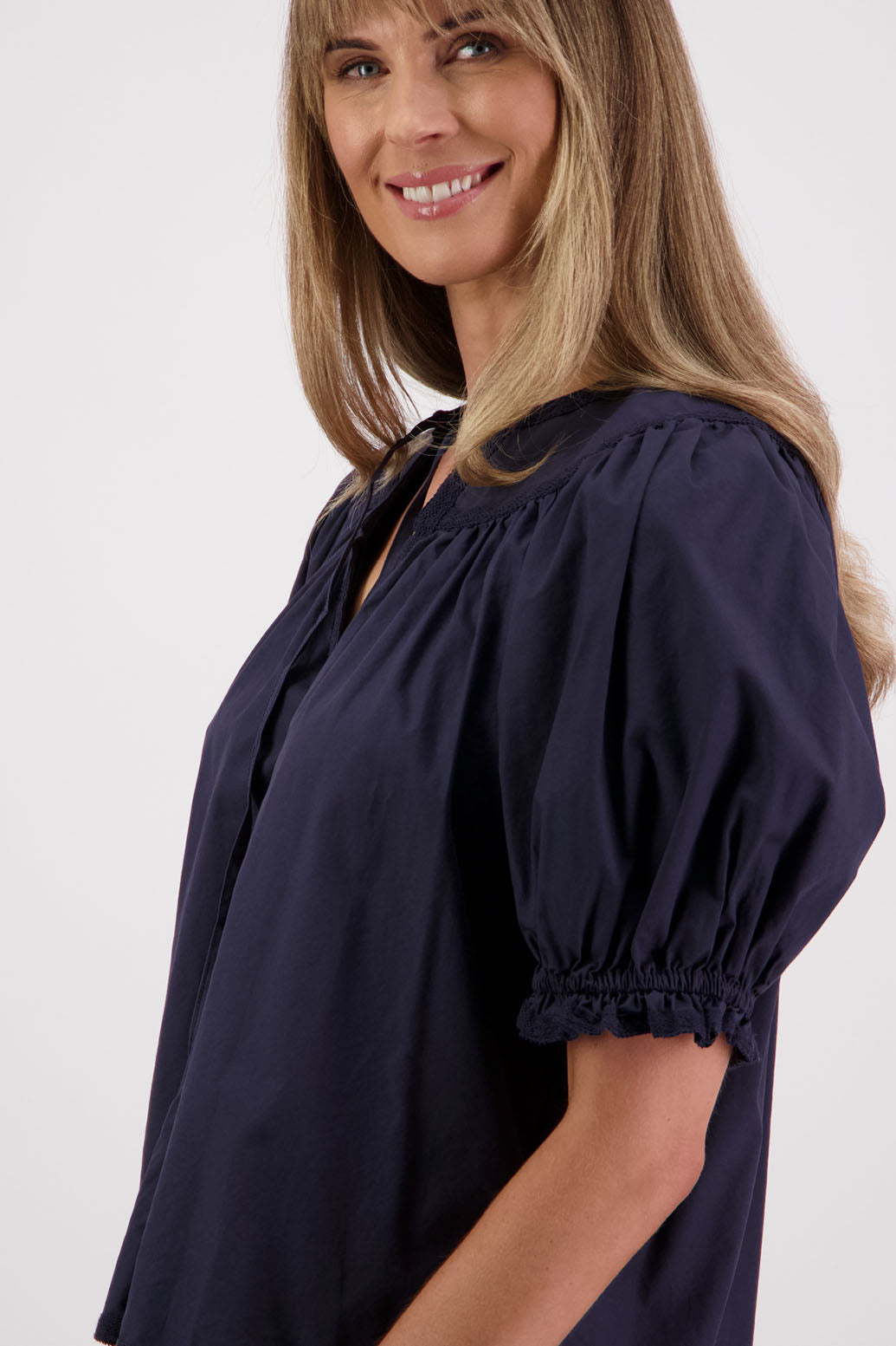 Womens Ink short sleeve top with soft gathering onto yolk with lace trim around the sleeves, hem + yolk. Briarwood NZ. Cotton Poplin / Lace. Selma