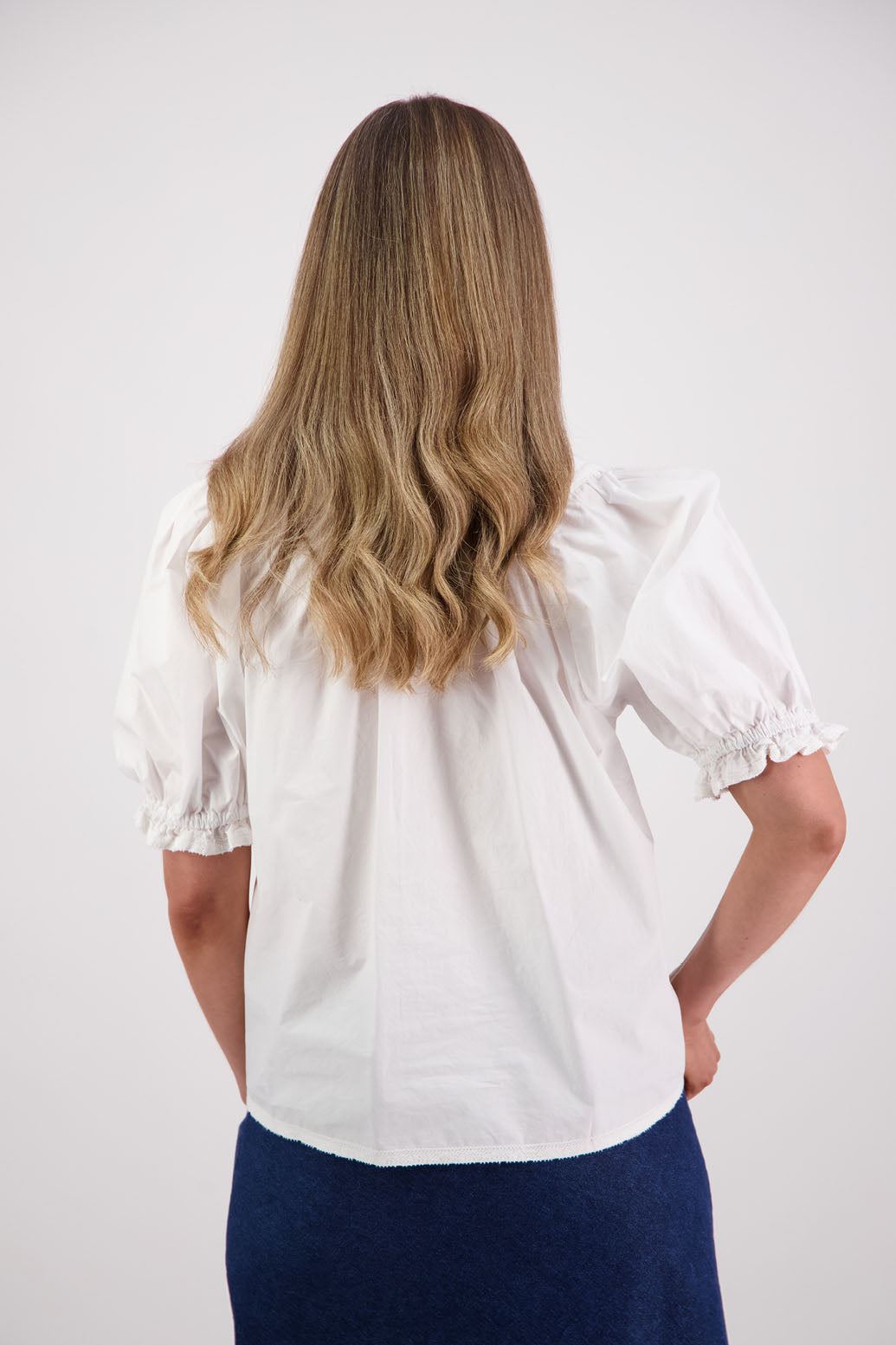 Womens white short sleeve top with soft gathering onto yolk with lace trim around the sleeves, hem + yolk. Briarwood NZ. Cotton Poplin / Lace. Selma