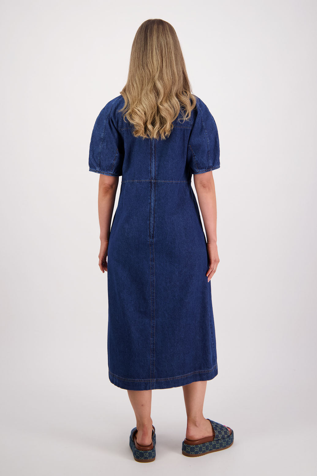 Womens denim dress, slim fitting body, curved empire line bodice and slight puff in panelled sleeves. Briarwood NZ