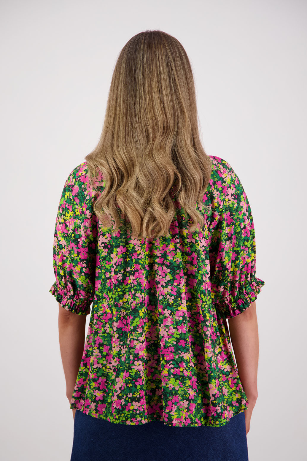 Womens longline viscose top with elbow length sleeves and elasticated neck and sleeves with slight ruffle. Briarwood NZ. Simone. Pansy Print