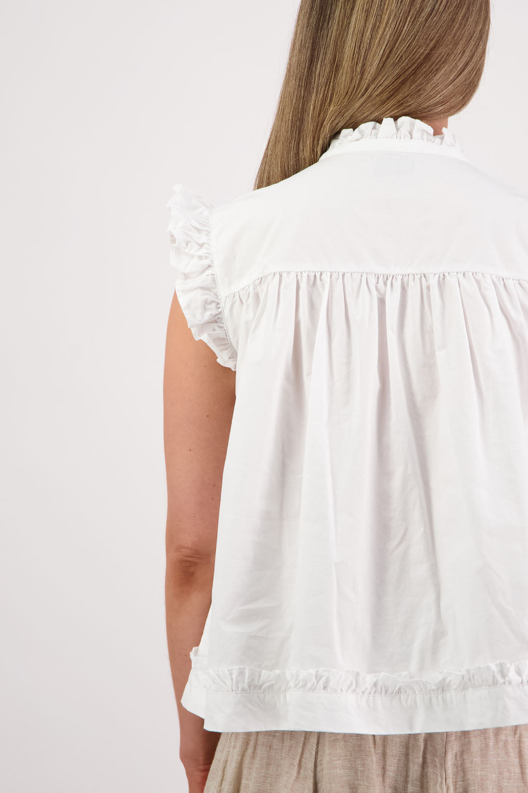 Womens white short sleeve wide top with V neck + tie, and small ruffle on the yolk, hem and sleeves. Briarwood NZ. Cotton Poplin. Skye