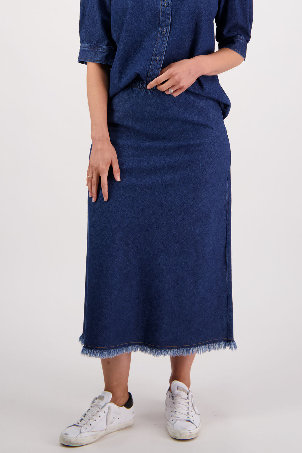Womens denim skirt with raw hem, bias cut and elasticated waist. Briarwood NZ