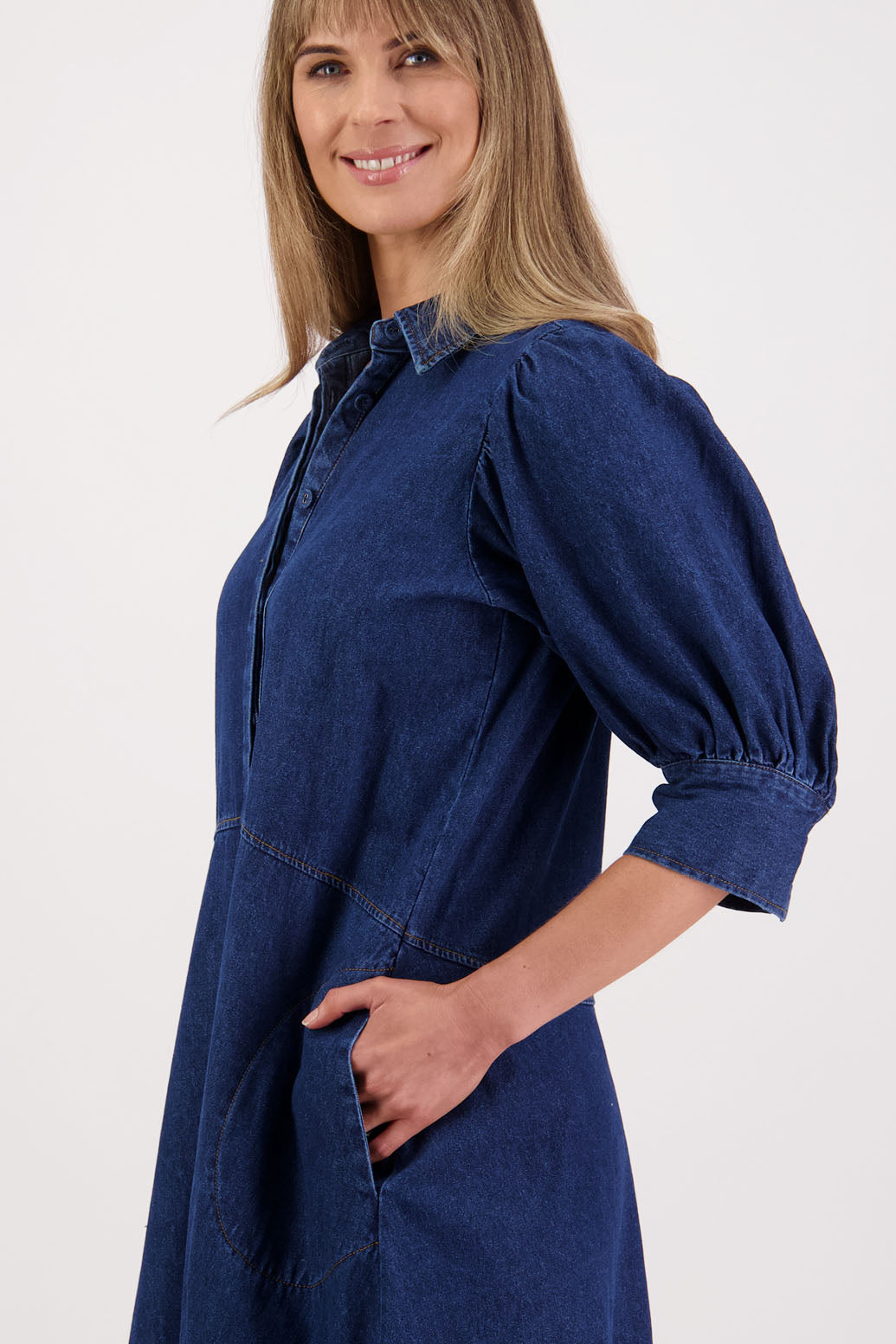 Womens denim dress with curved waist and slight puff below the elbow sleeves.Briarwood NZ. Steffie
