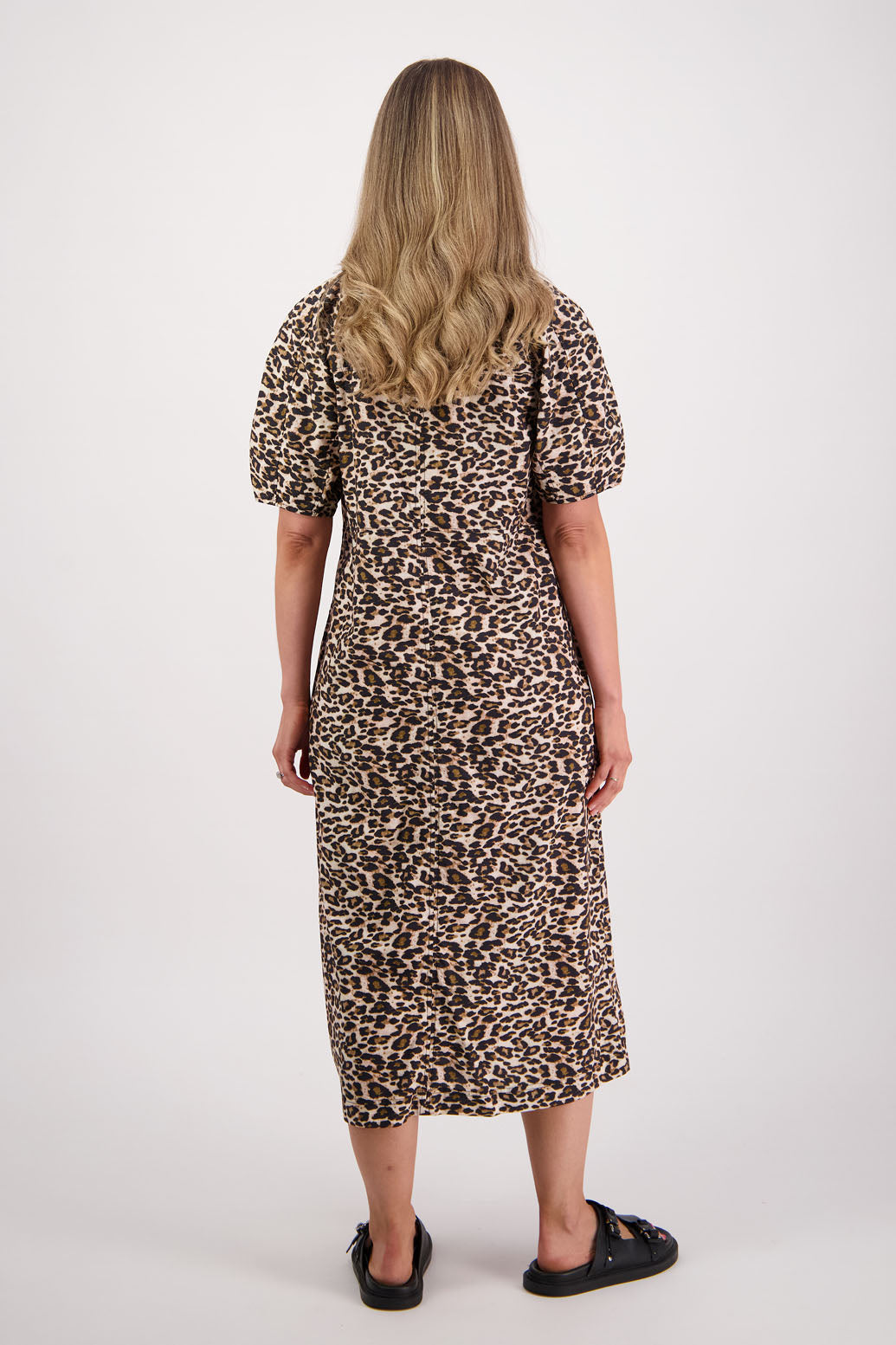Womens Leopard print cotton poplin dress with slight puff sleeves and empire line bodice. Briarwood NZ. Steph