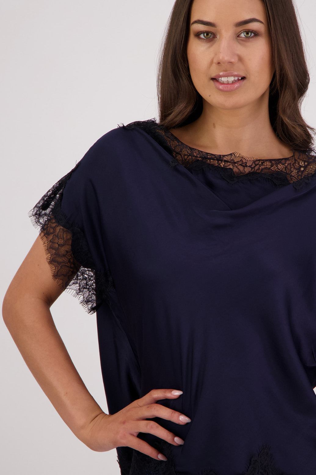 Closeup front view Briarwood Tabby Top in ink, 100% viscose with black lace trims.