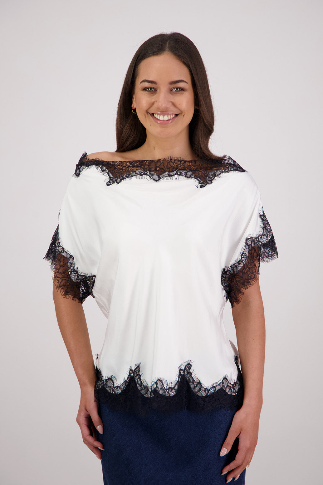 Briarwood Tabby Top in a ivory, 100% viscose with black lace trims.