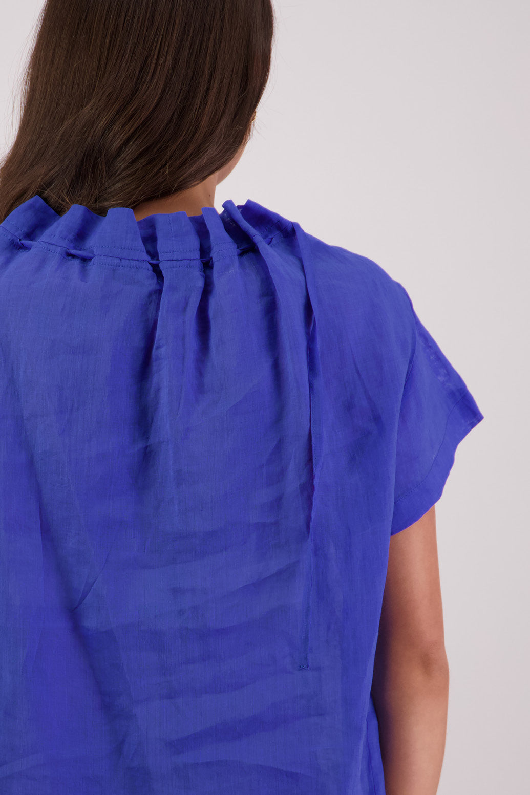 Closeup back view Briarwood Taffy Top in Royal Blue.
