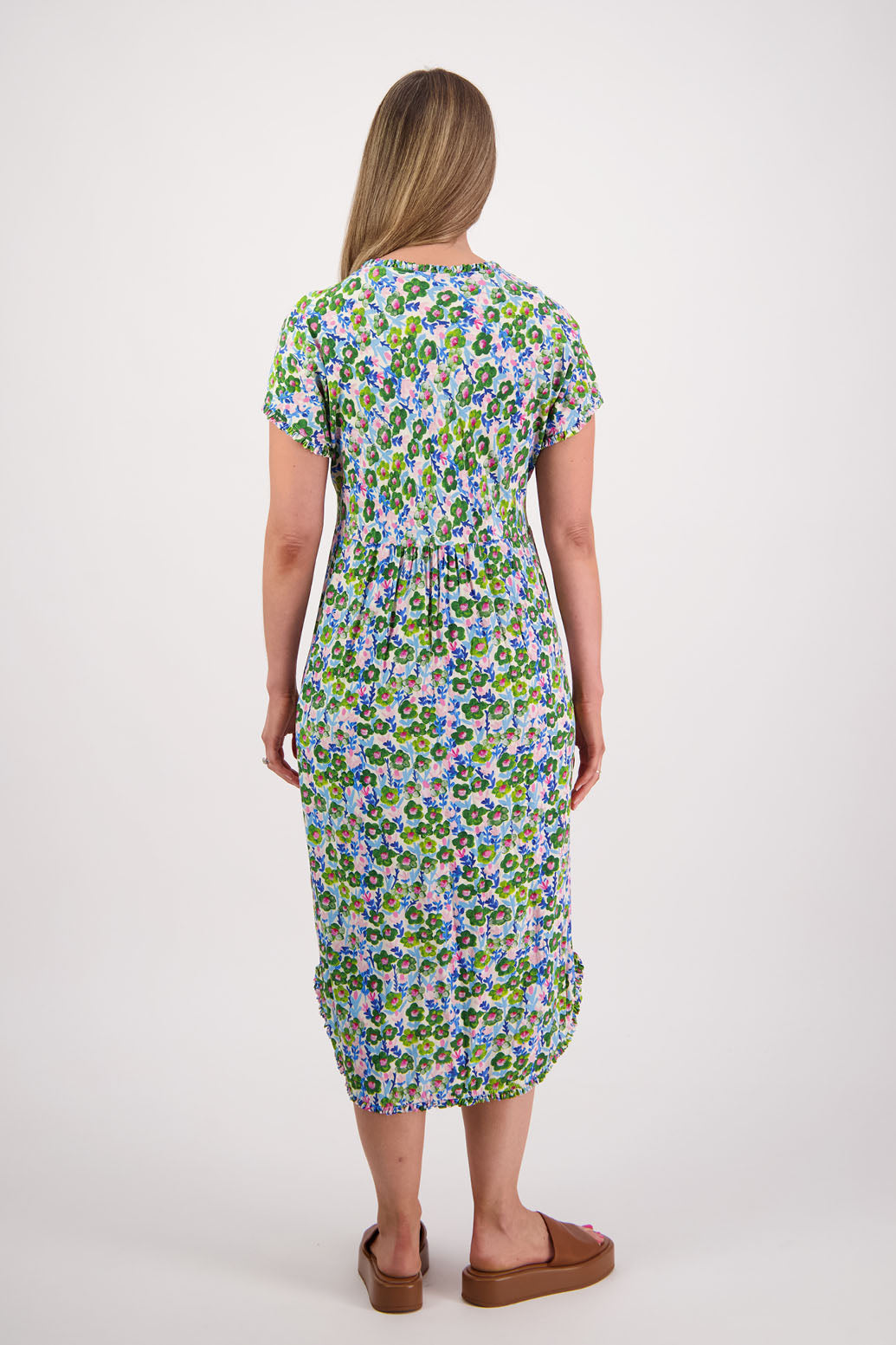 Womens midi dress with bias cut bust and v neck, straight skirt, shaped hem and ruffles around neck, sleeves and hem. Briarwood NZ. Viscose. Taylor. Daisy print