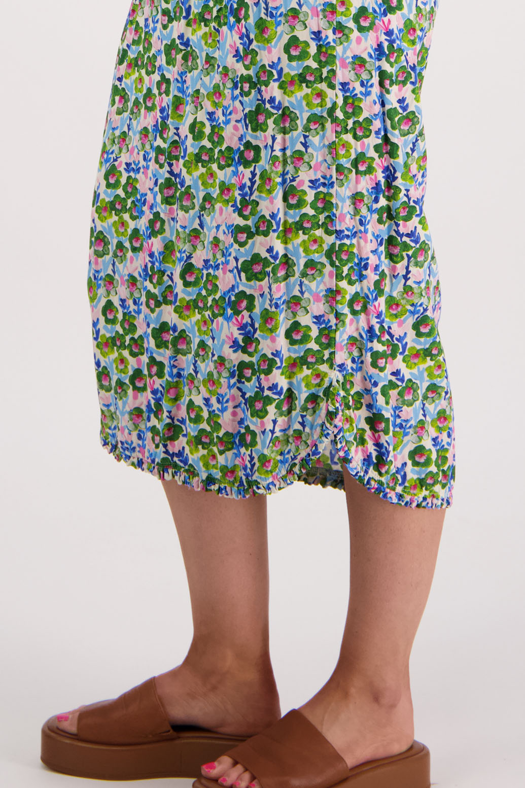 Womens midi dress with bias cut bust and v neck, straight skirt, shaped hem and ruffles around neck, sleeves and hem. Briarwood NZ. Viscose. Taylor. Daisy print
