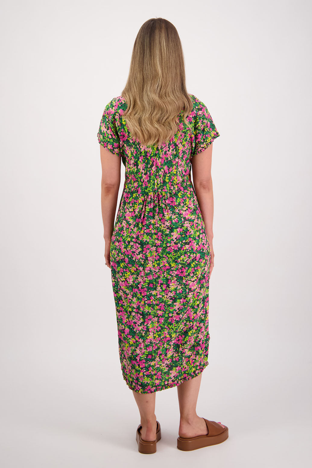 Womens midi dress with bias cut bust and v neck, straight skirt, shaped hem and ruffles around neck, sleeves and hem. Briarwood NZ. Viscose. Taylor. Pansy print