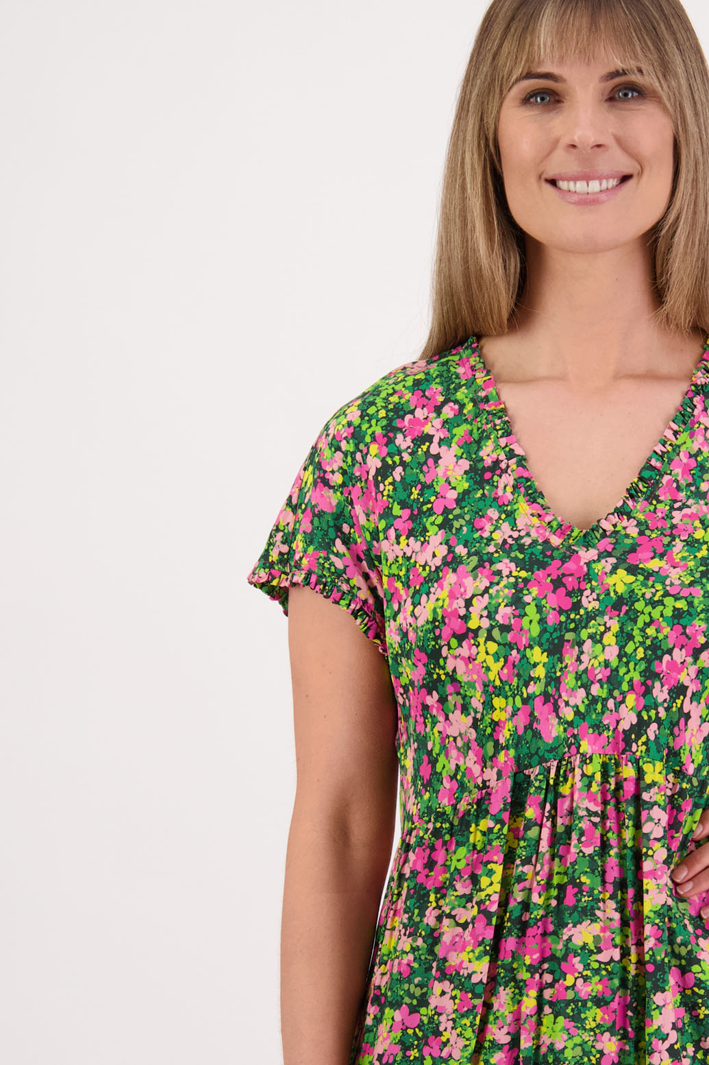 Womens midi dress with bias cut bust and v neck, straight skirt, shaped hem and ruffles around neck, sleeves and hem. Briarwood NZ. Viscose. Taylor. Pansy print