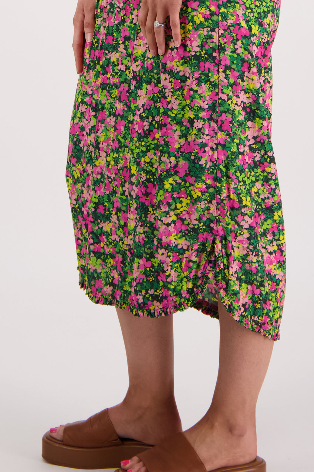 Womens midi dress with bias cut bust and v neck, straight skirt, shaped hem and ruffles around neck, sleeves and hem. Briarwood NZ. Viscose. Taylor. Pansy print