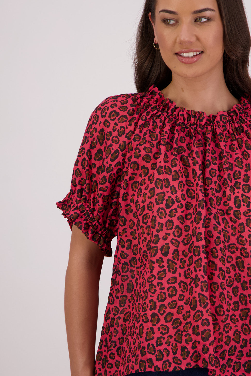 Closeup of front of Briarwood Teddy Top in red animal print.