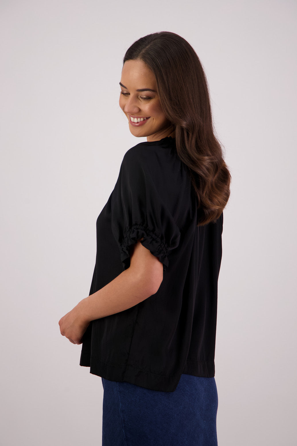 Side view Briarwood Teddy top in black.