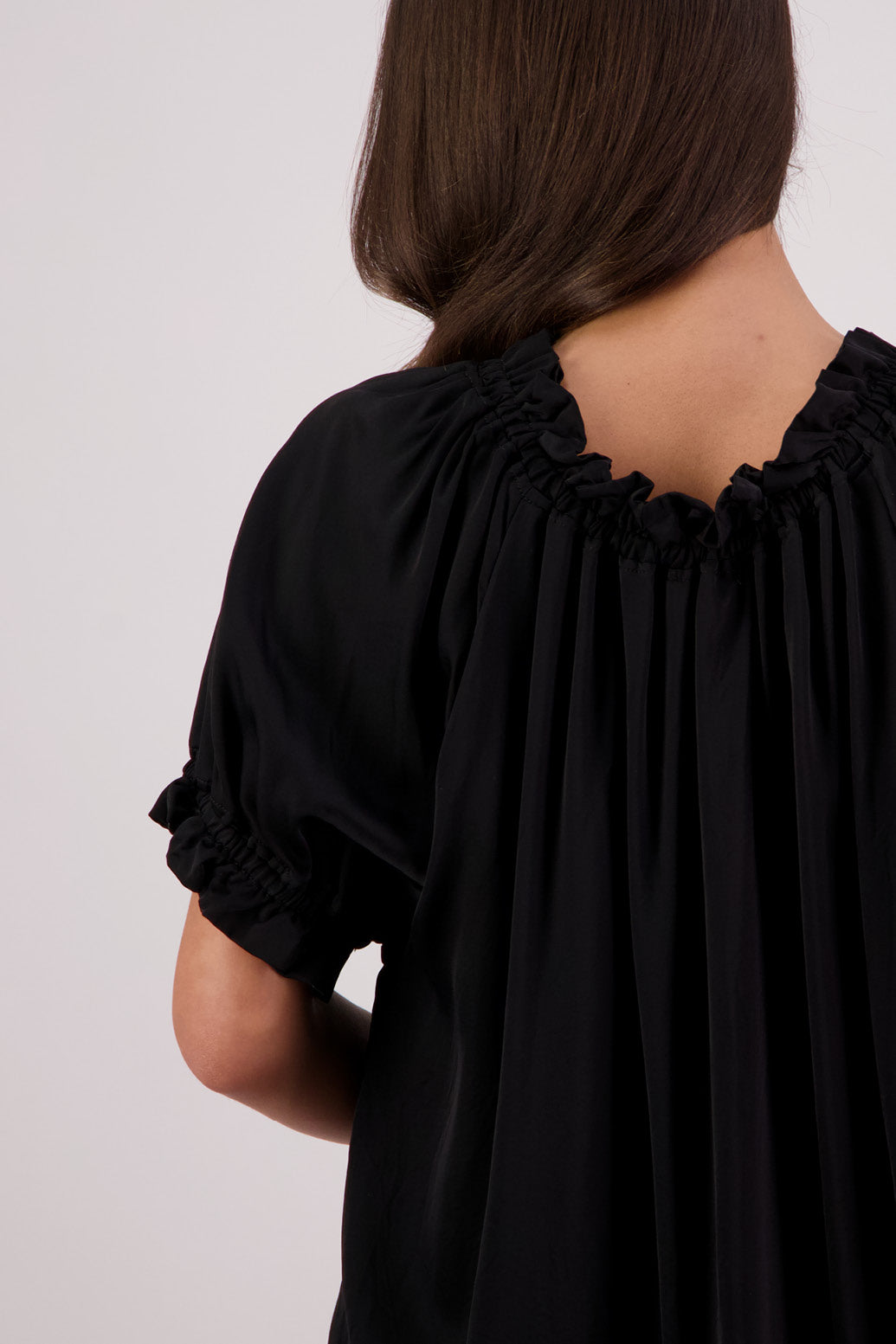 Close up back view Briarwood Teddy top in black.