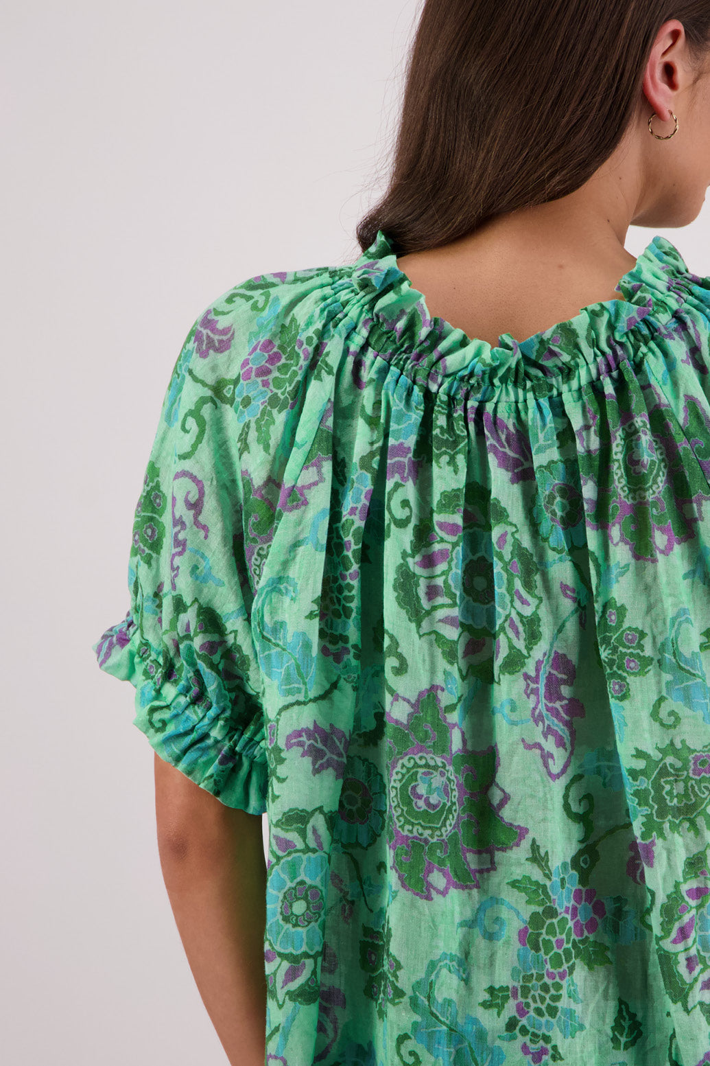 Close up of back view of Briarwood Teddy Top in green floral print.