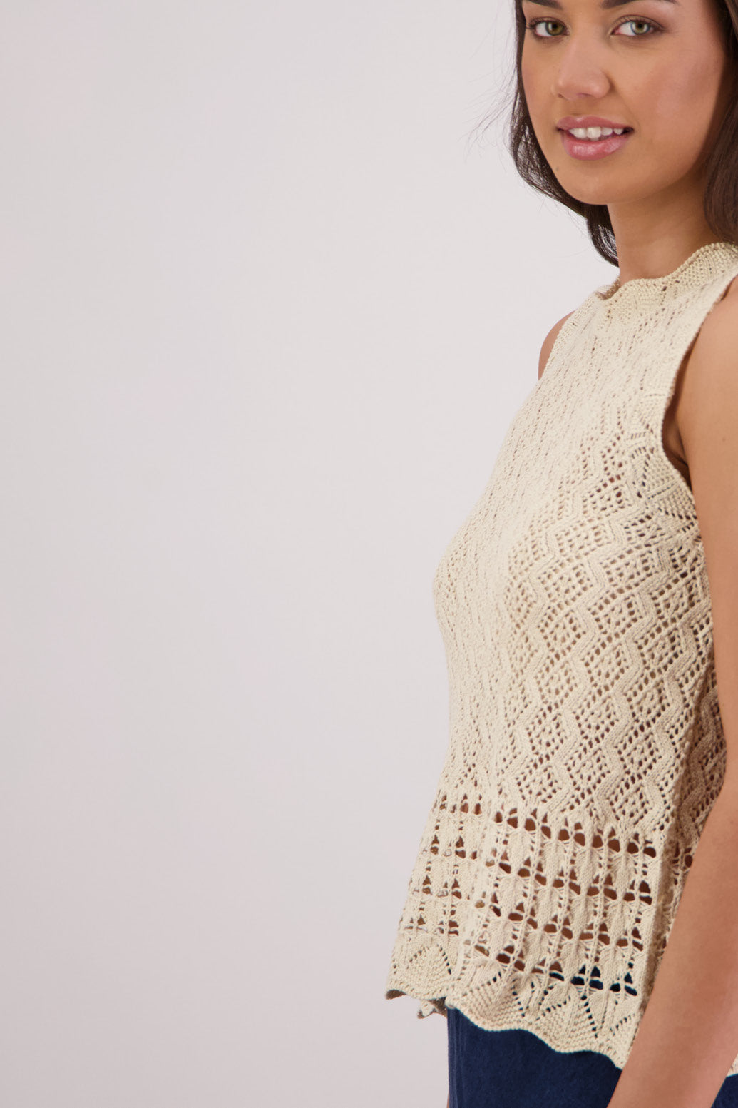 Closeup side view Briarwood Temple Sleeveless Top in Natural.