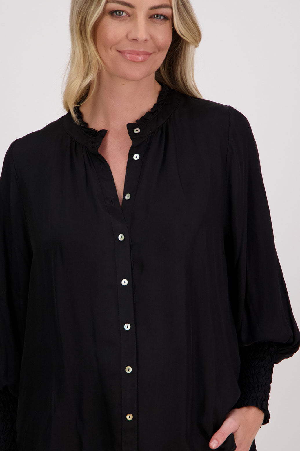 Black Viscose long sleeve shirt with ruffle collar and shirred sleeves with ruffle. Audrey