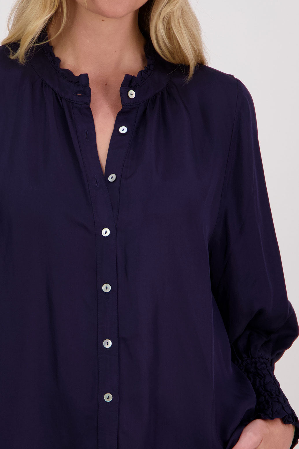 Ink Viscose long sleeve shirt with ruffle collar and shirred sleeves with ruffle. Audrey