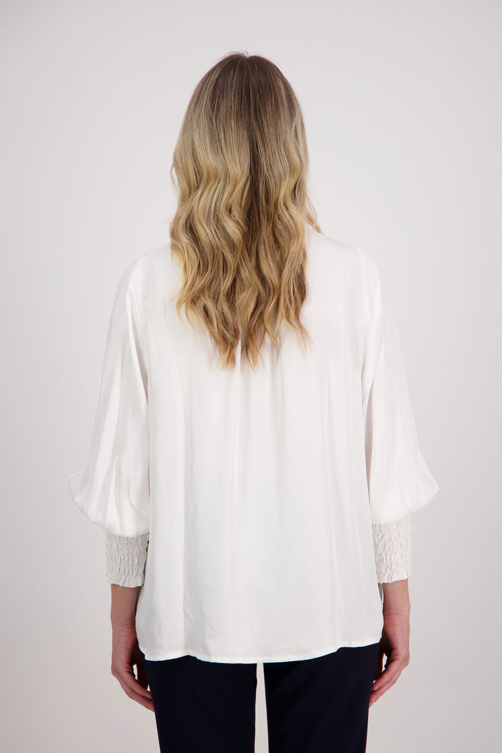 Ivory/White Viscose long sleeve shirt with ruffle collar and shirred sleeves with ruffle. Audrey