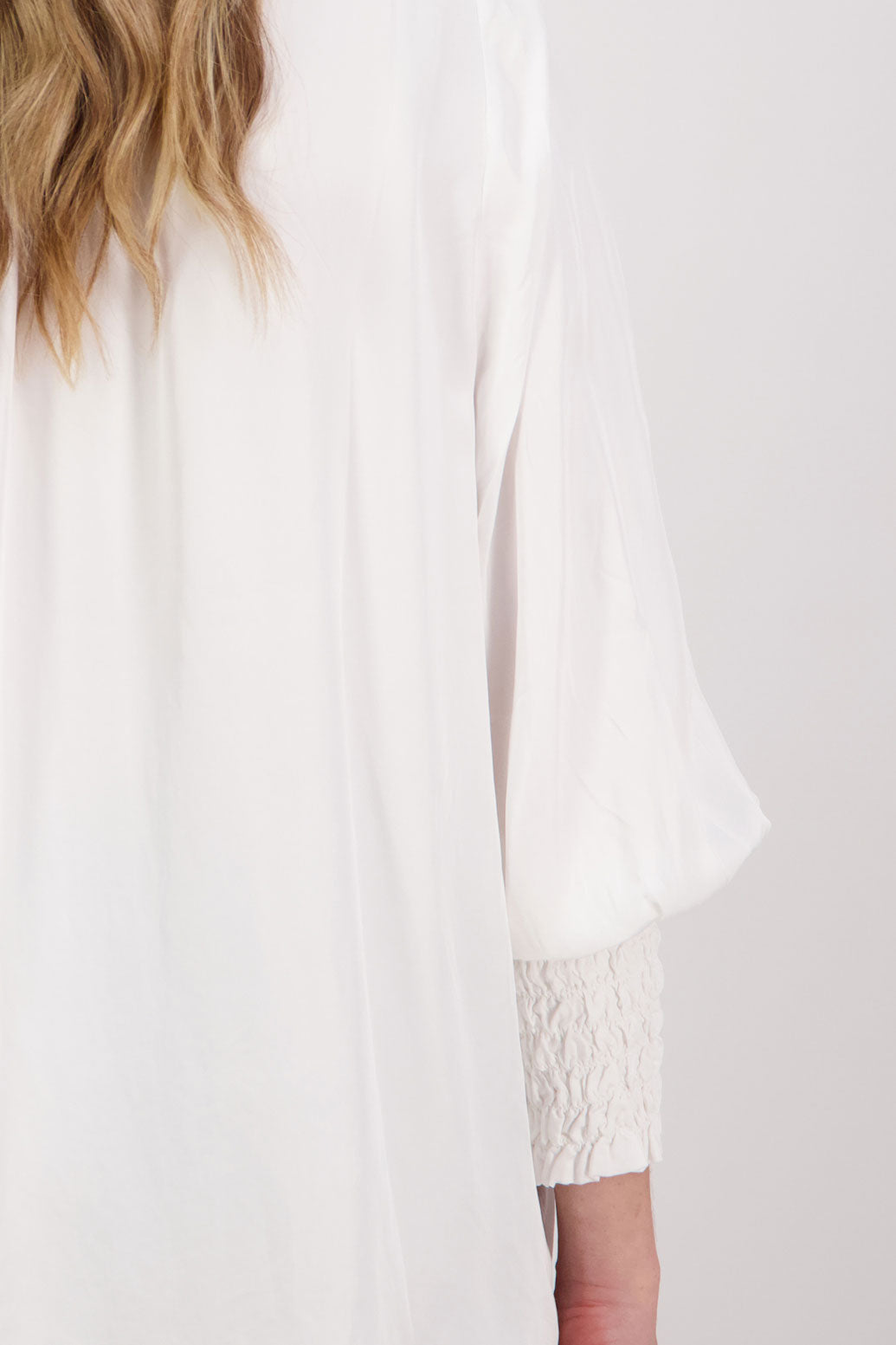 Ivory/White Viscose long sleeve shirt with ruffle collar and shirred sleeves with ruffle. Audrey